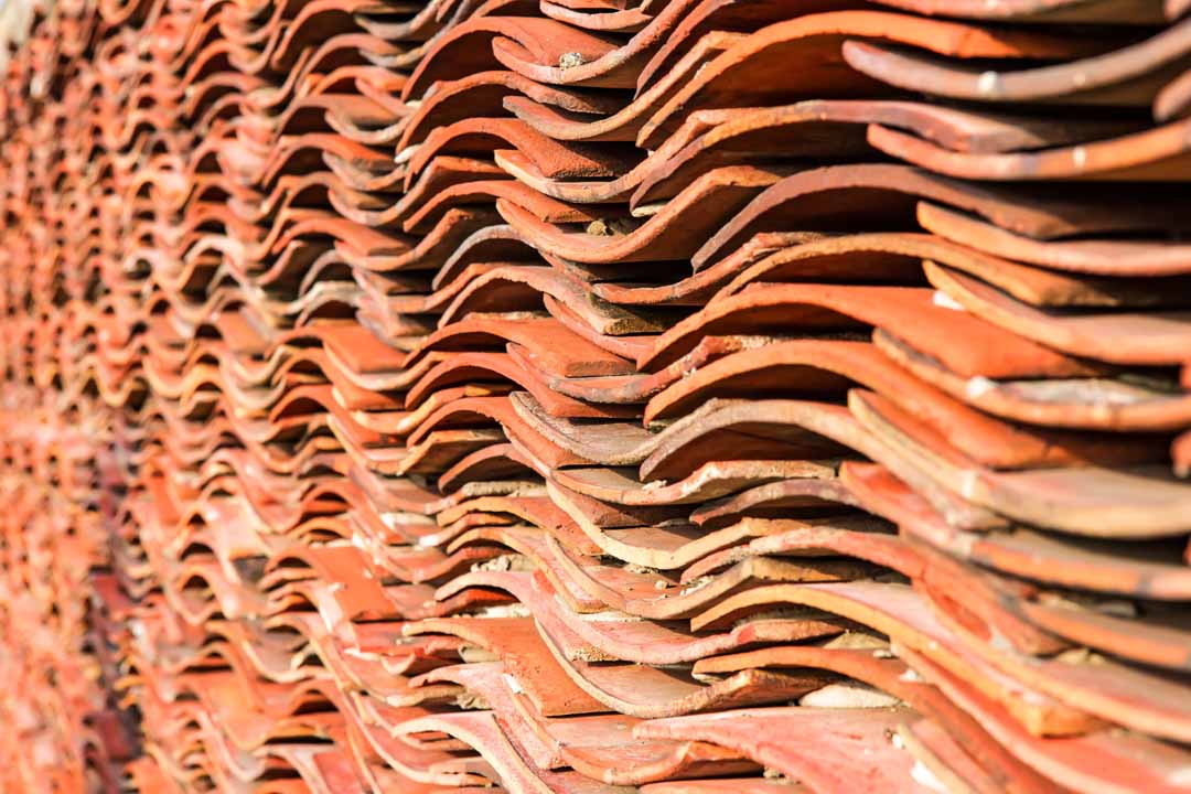 Stack of reclaimed tiles available for matching to existing roof tiles
